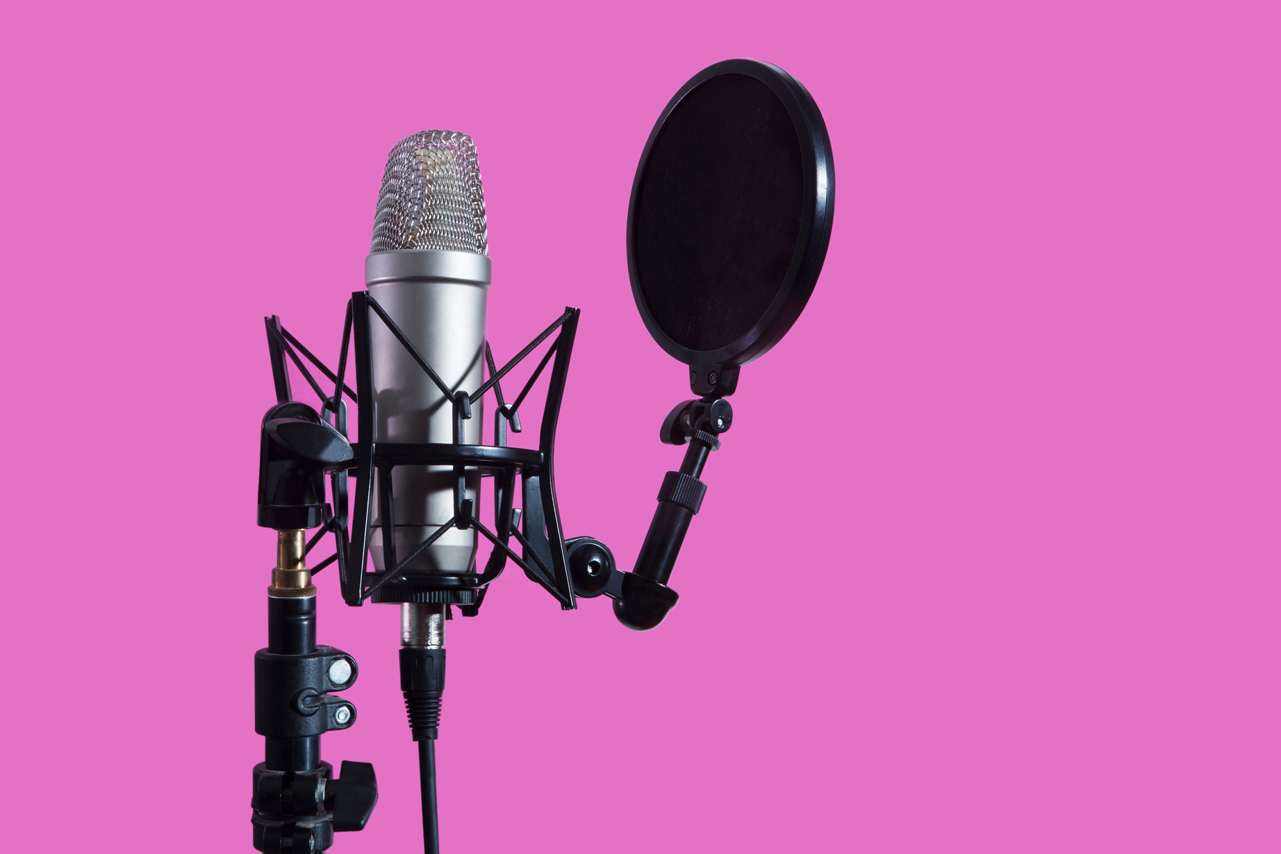 Professional microphone with waveform and headphones on a pink background banner. Podcast or recording studio background